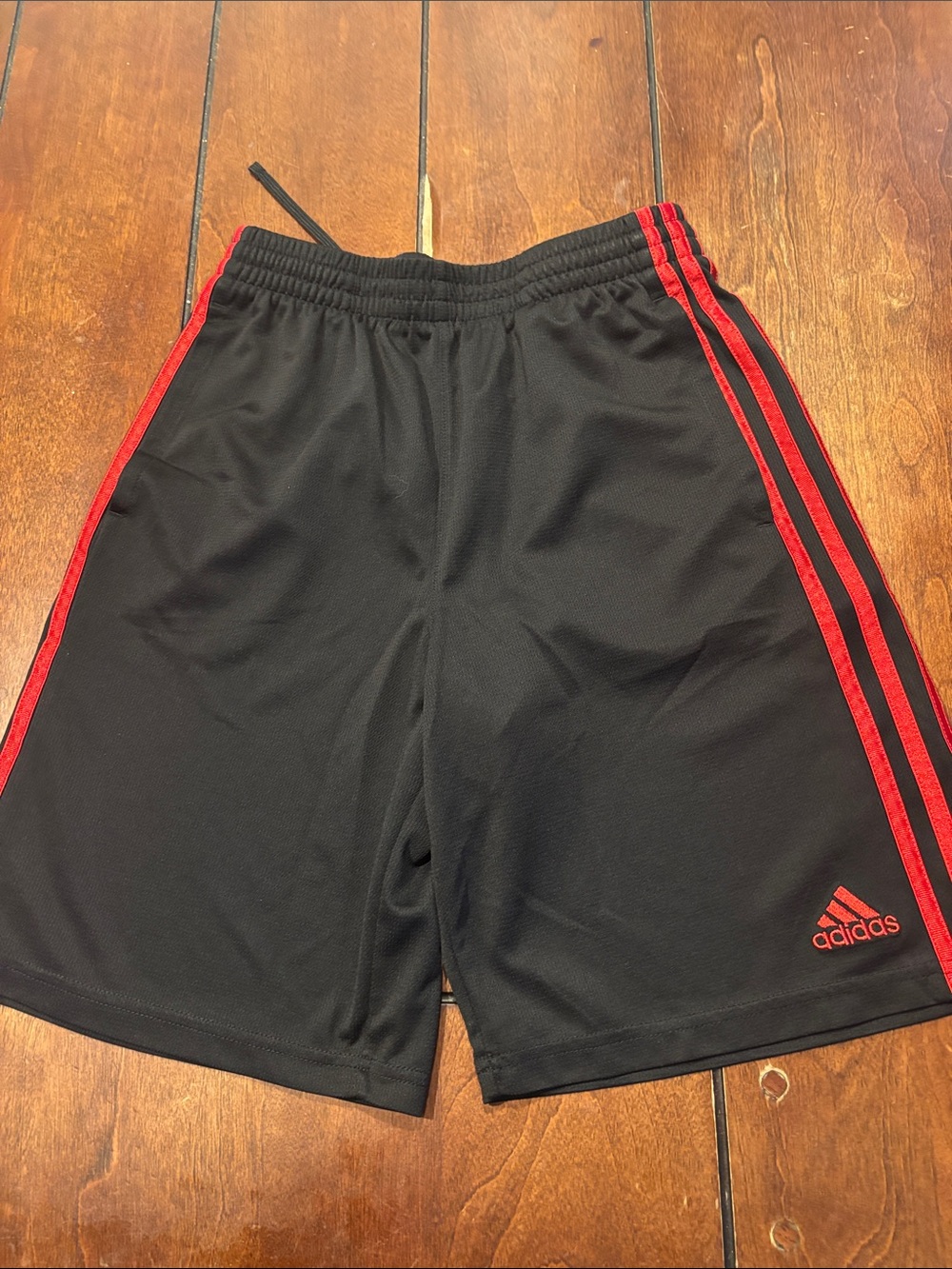 adidas boys Black Athletic Shorts with Red Side Stripes